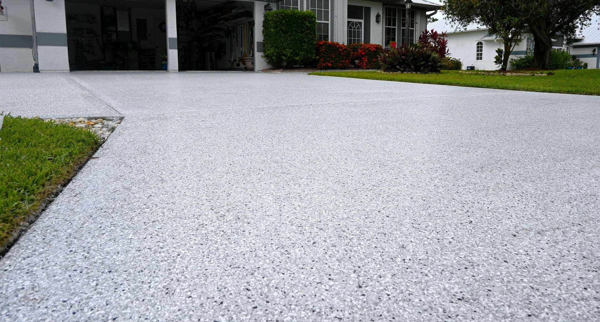 Polyaspartic driveway coating installed by Ox Floors on a Florida home.